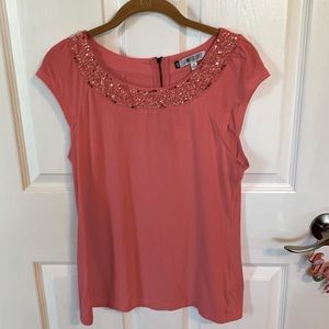 J LO top with sequins around the neck